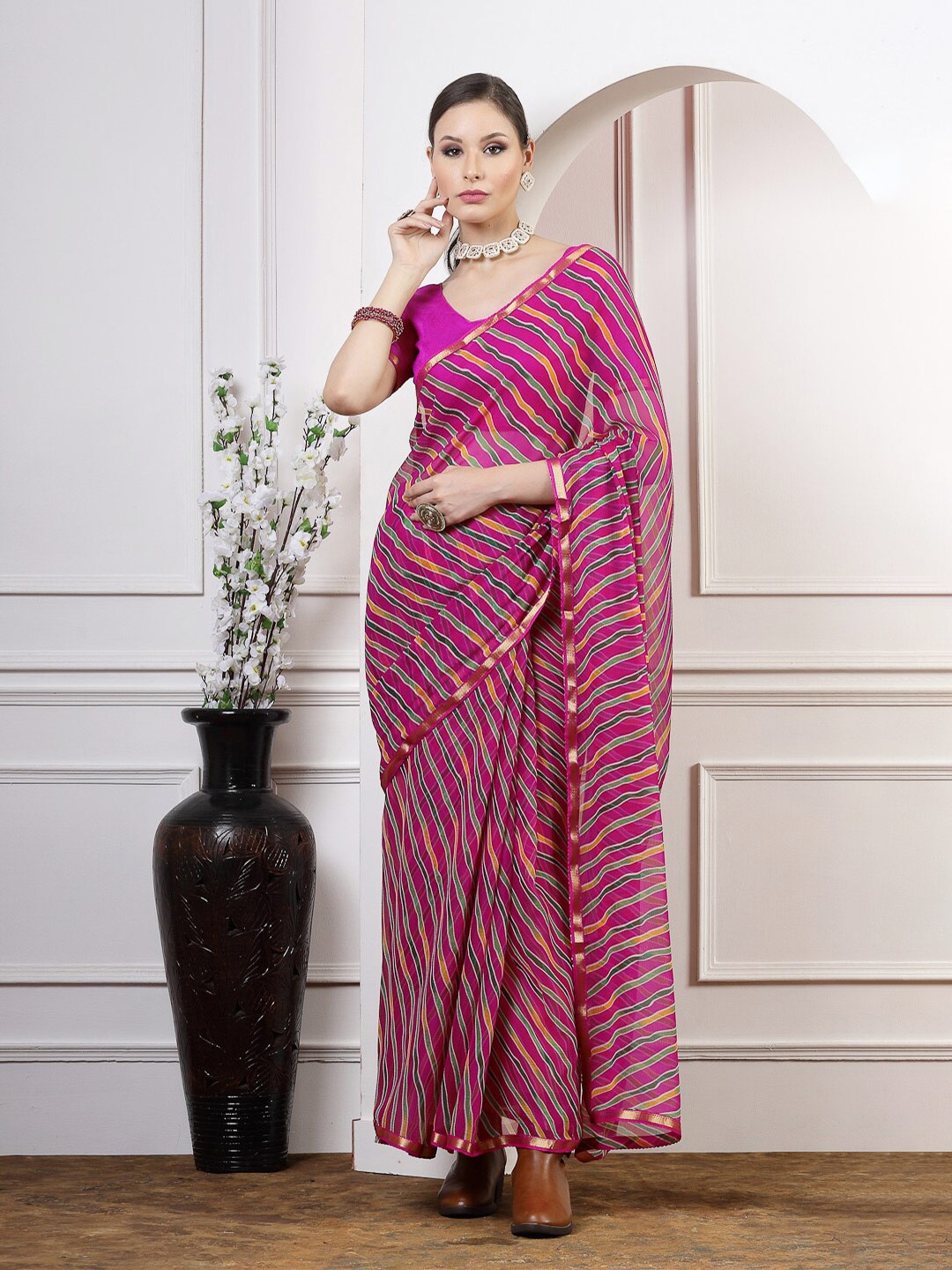 

Satrani Pink & Green Leheriya Zari Poly Chiffon Saree