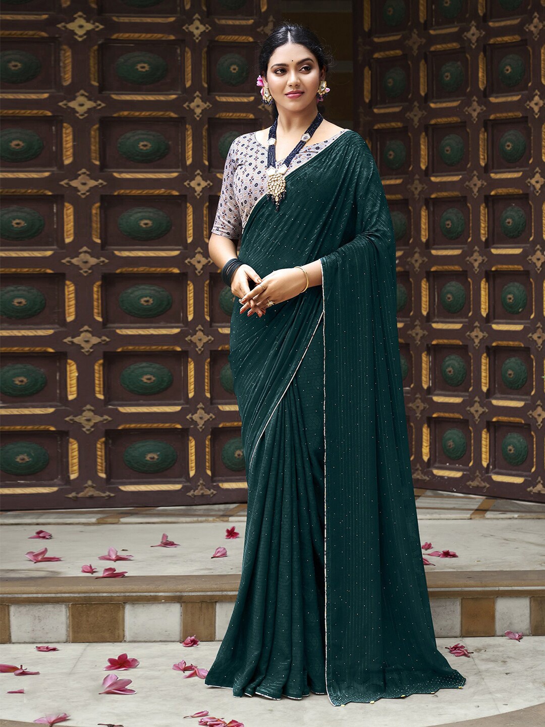 

Satrani Teal & Silver-Toned Striped Beads and Stones Poly Georgette Saree