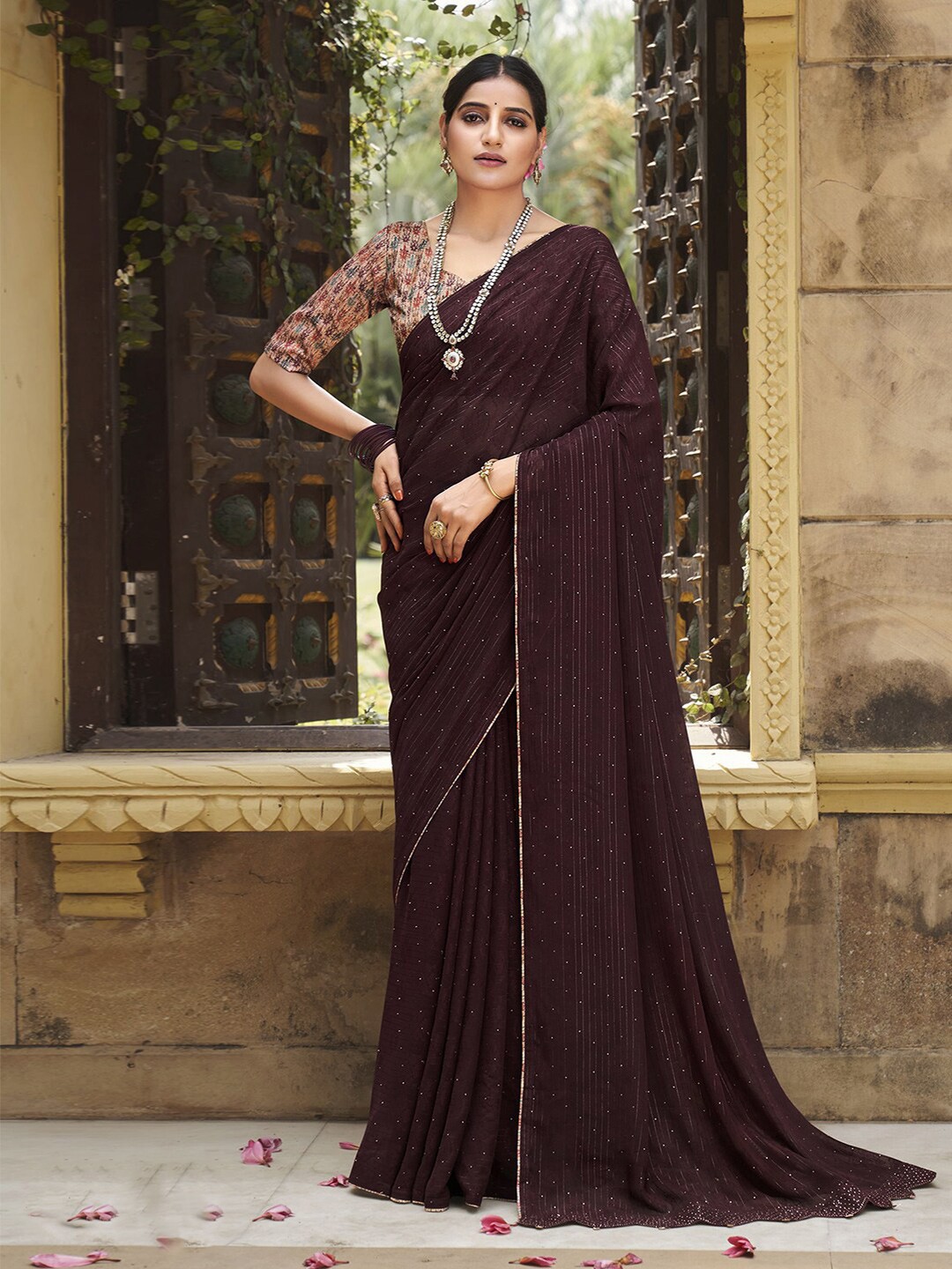 

Satrani Brown & Blue Ethnic Motifs Beads and Stones Poly Georgette Saree