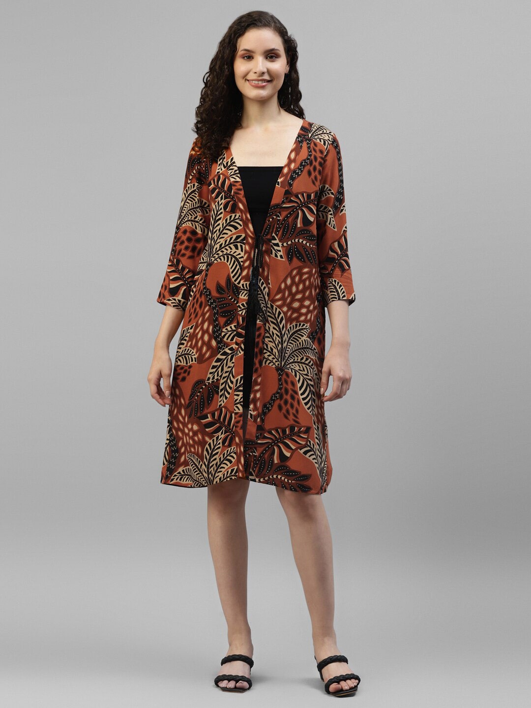 

DEEBACO Women Rust & Black Printed Longline Tropical Tie-Up Shrug