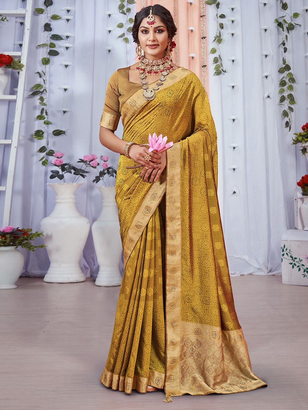 

Mitera Brown & Gold-Toned Ethnic Motif Woven Design Zari Saree