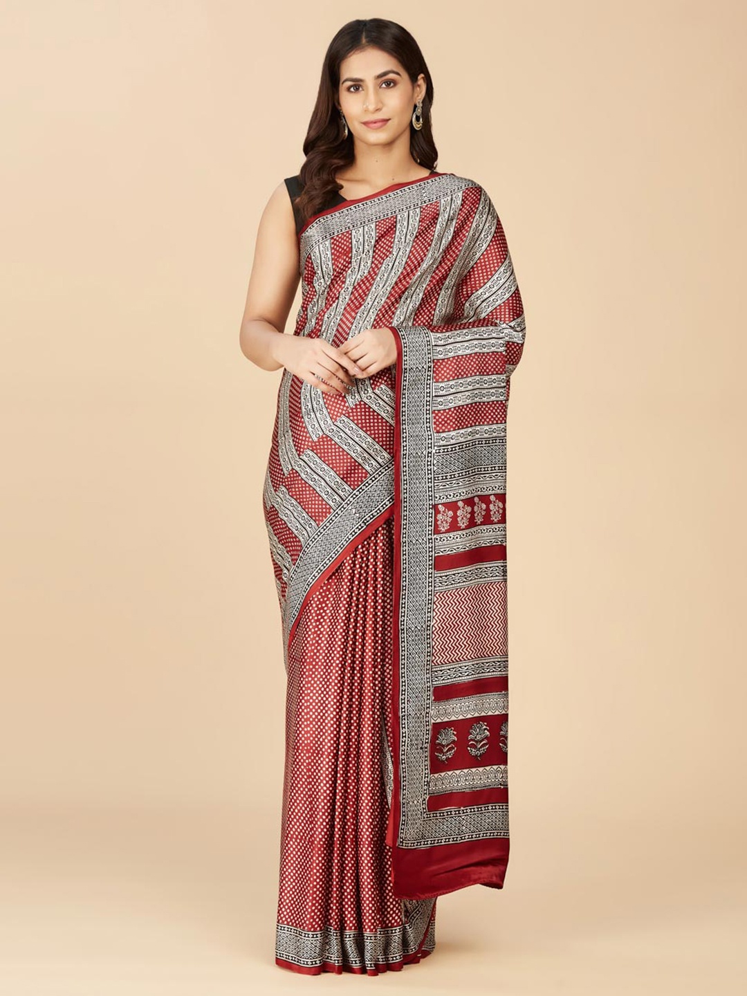 

Fabindia Maroon & White Ethnic Motifs Saree