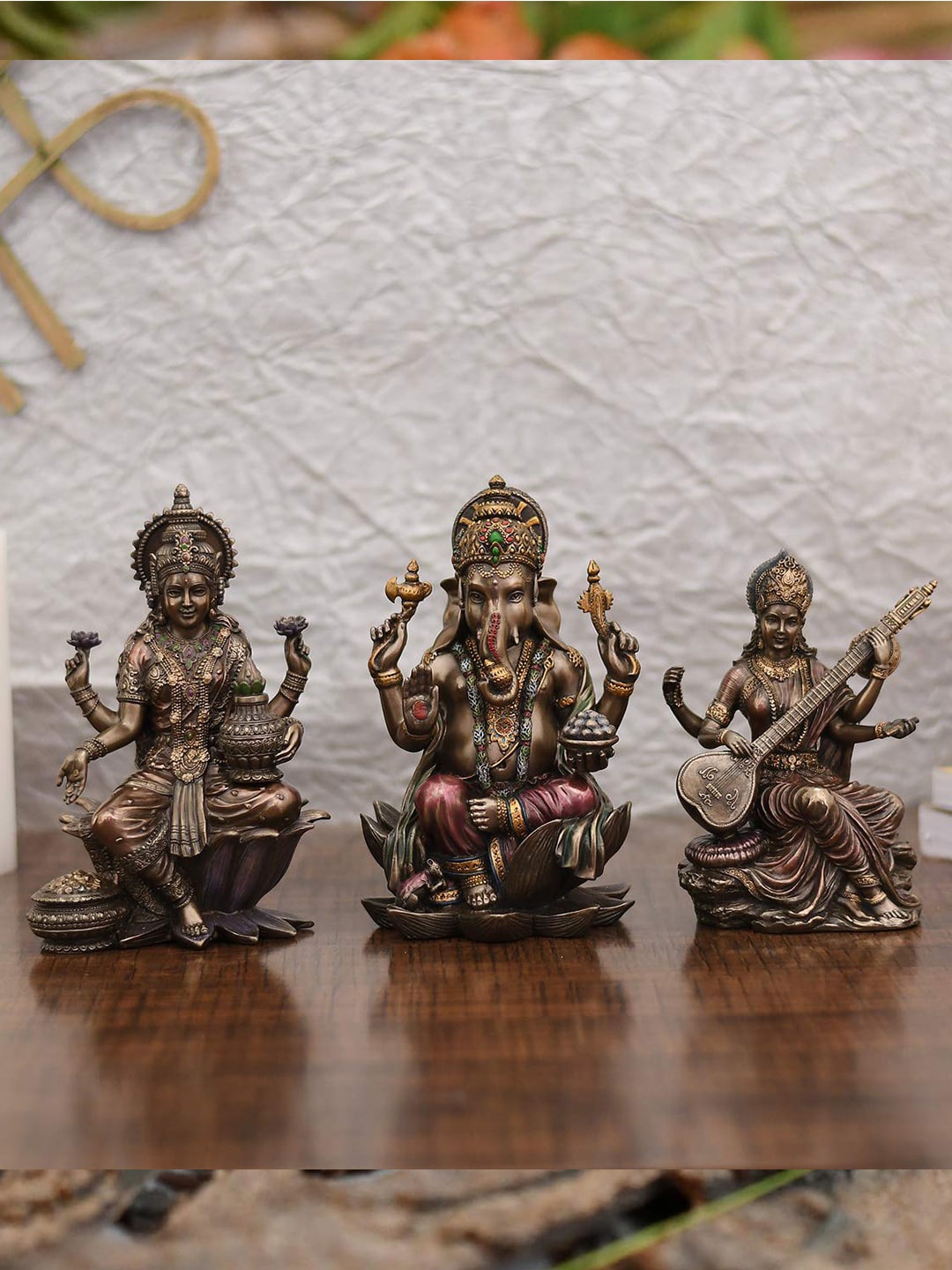 

CraftVatika Brown 3 Pieces Lakshmi Ganesha & Saraswati Metal Idol Showpieces