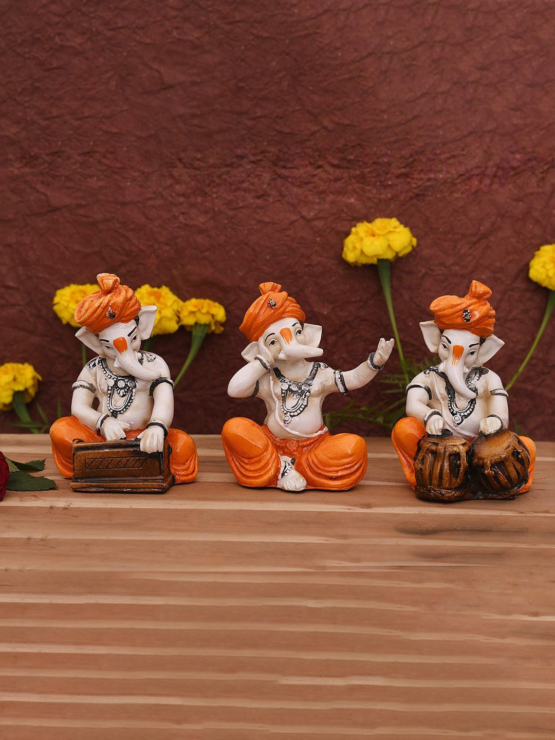 

CraftVatika Orange & Beige 3 Pieces Musician Lord Ganesha Showpieces