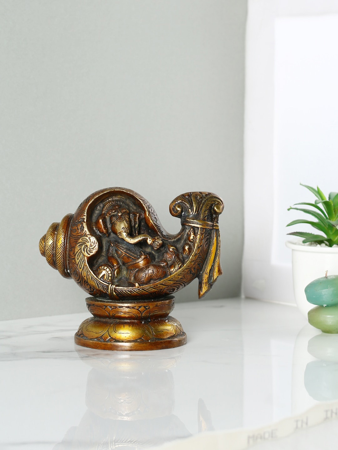 

CraftVatika Brown Textured Conch Ganesha Brass Idol Showpiece