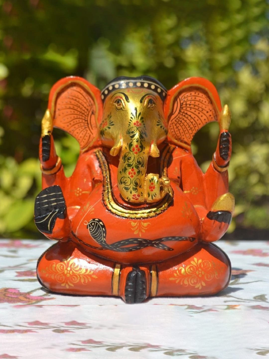 

CraftVatika Orange & Yellow Textured Ganesh Wooden Idol Showpiece