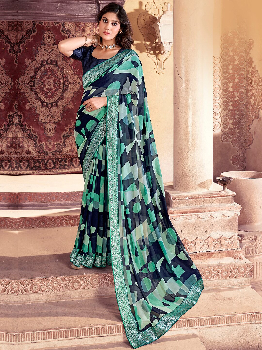 

Saree mall Navy Blue Geometric Printed Zari Poly Georgette Sarees