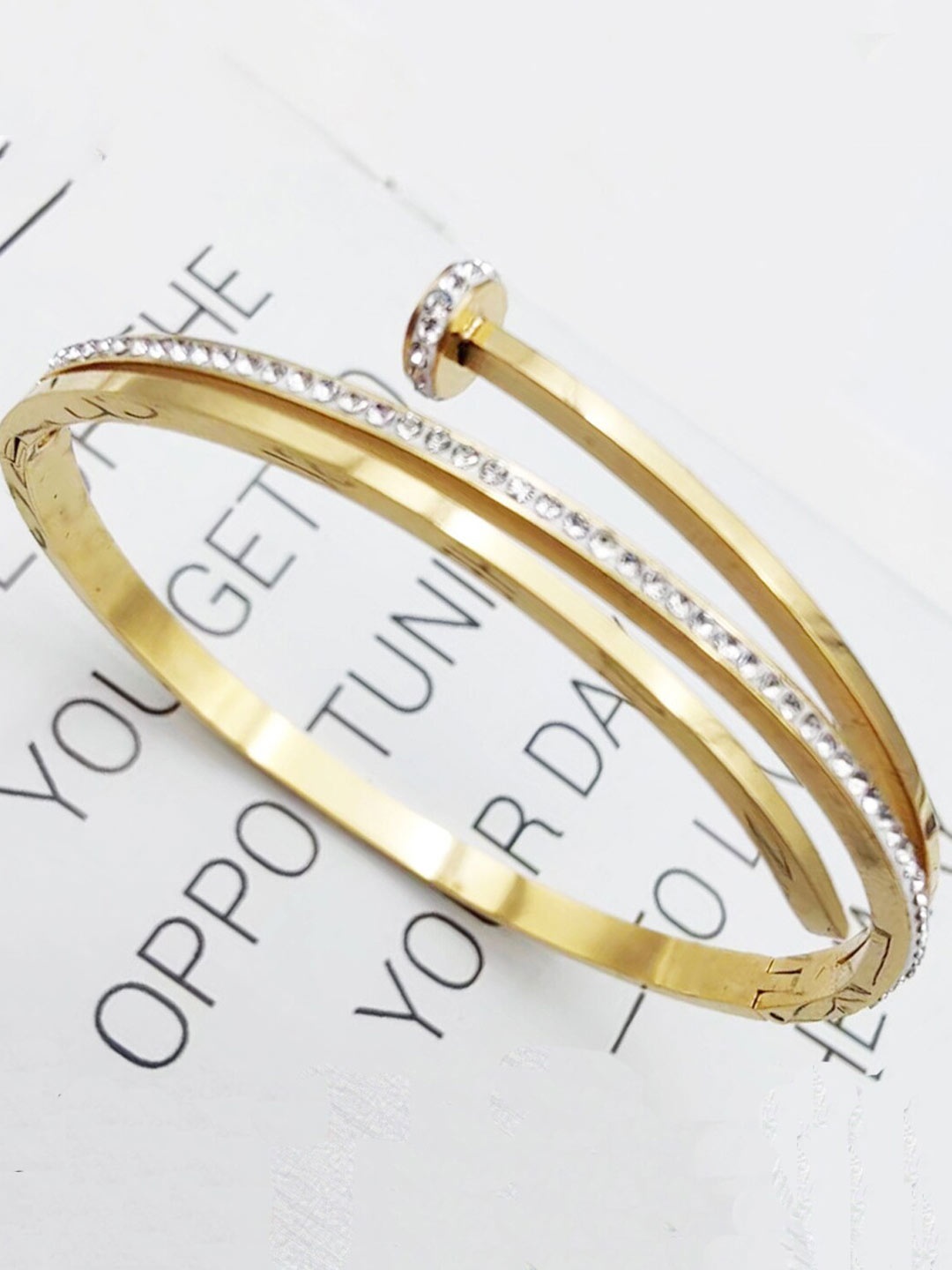 

Jewels Galaxy Gold-Plated American Diamond Stainless Steel Bangle-Style Bracelet