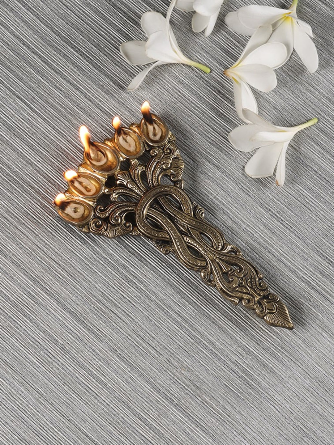 

Two Moustaches Beige Sheshnag Design Five Oil Wick Pooja Spoon