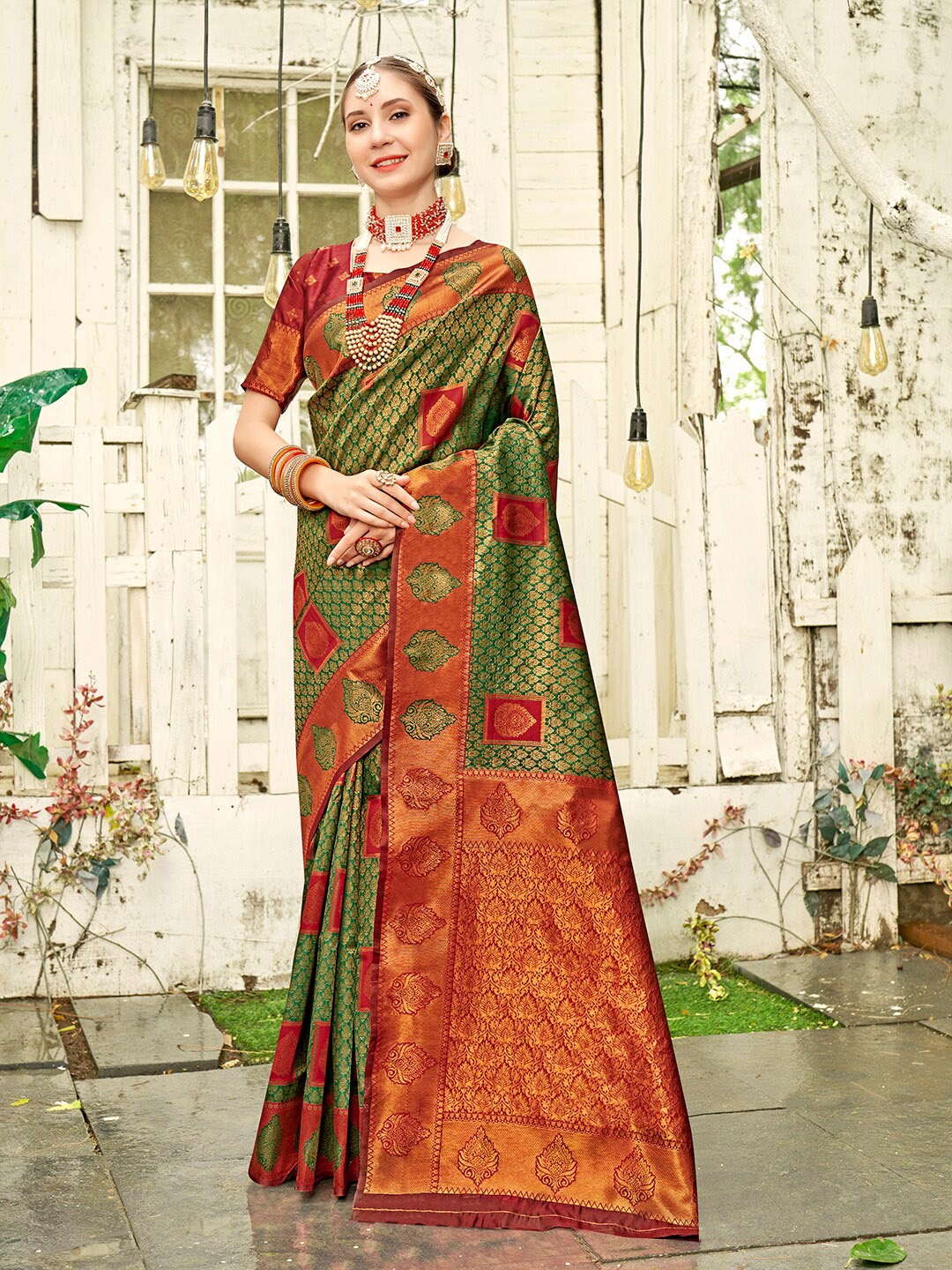 

Anouk Green Ethnic Motifs Woven Design Zari Detailed Kanjeevaram Saree