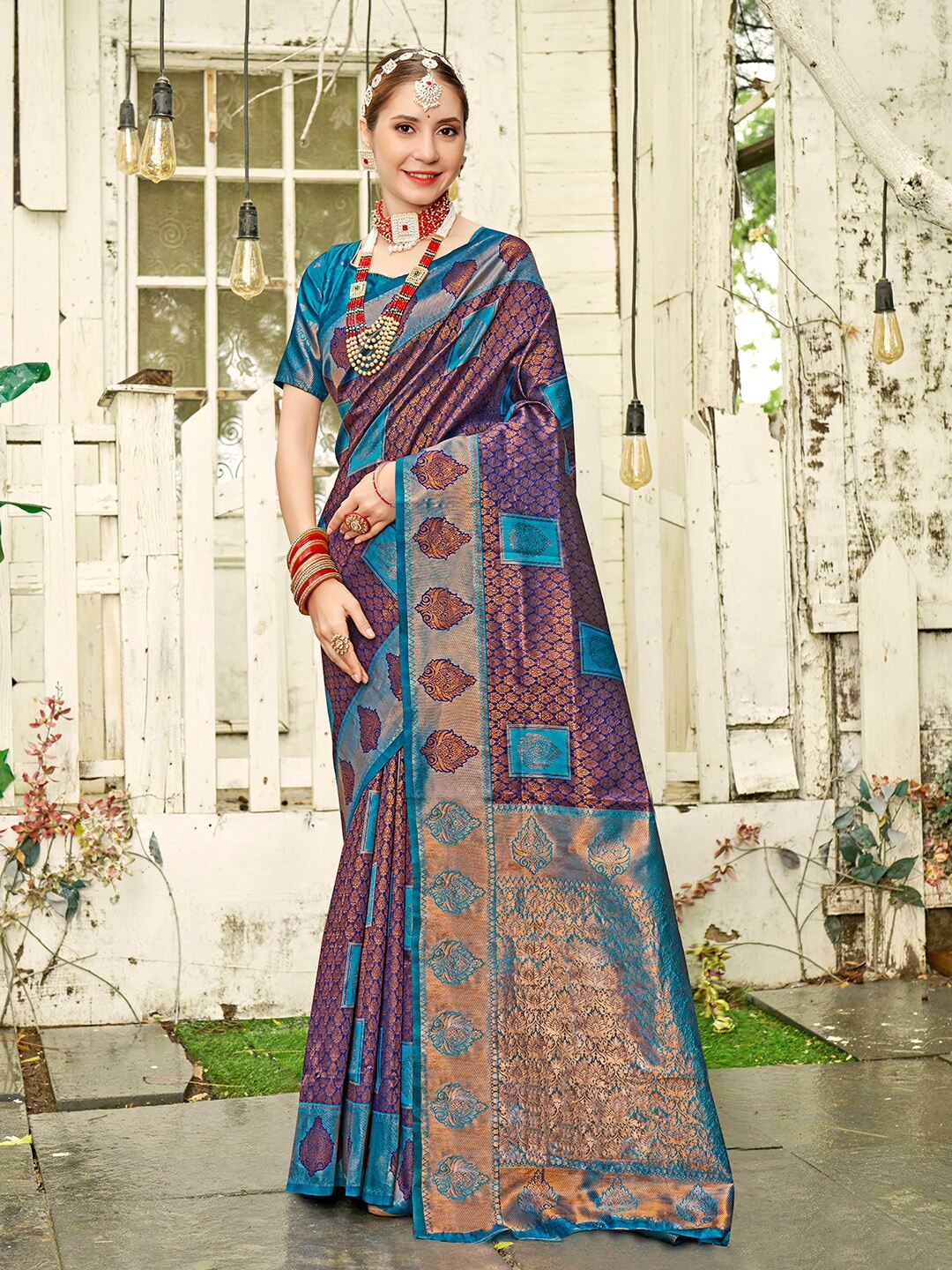 

Anouk Blue & Purple Ethnic Motifs Woven Design Zari Kanjeevaram Saree