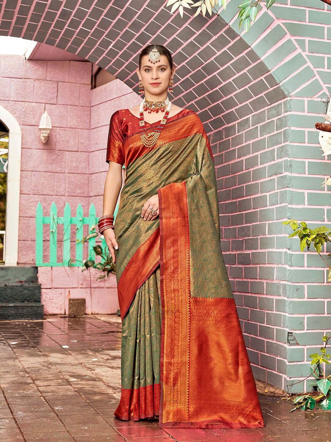 

Anouk Green & Red Ethnic Motifs Woven Design Zari Kanjeevaram Saree