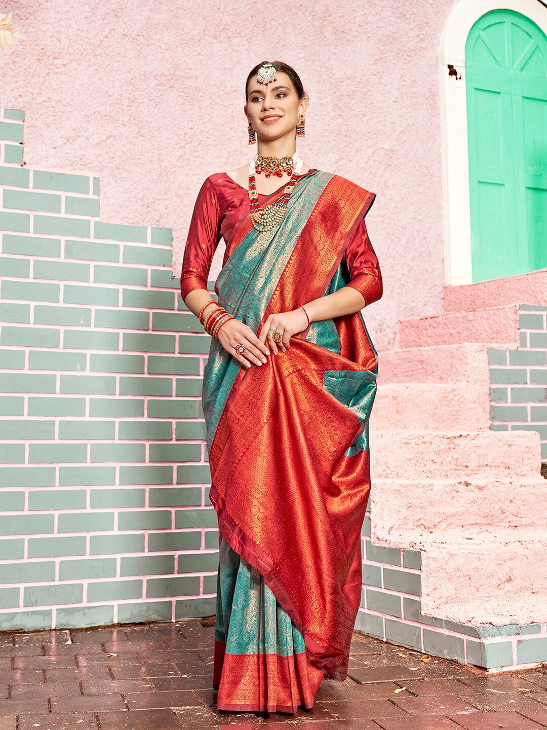

Anouk Turquoise Blue & Red Ethnic Motifs Woven Design Zari Kanjeevaram Saree