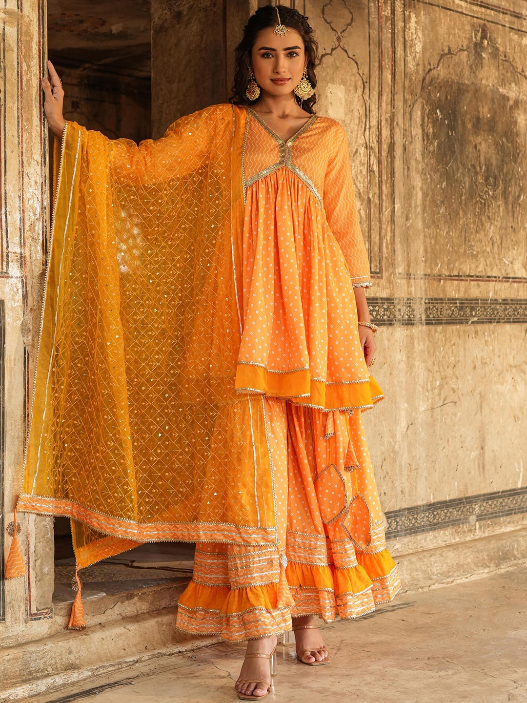 

SCAKHI Bandhani Printed Empire Gotta Patti Chanderi Silk Kurti With Sharara & Dupatta, Yellow
