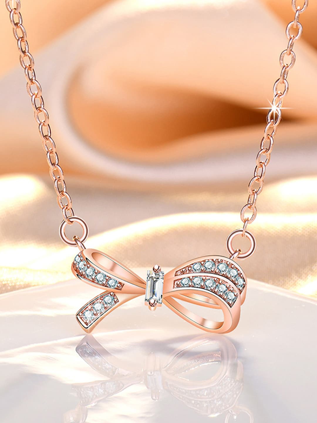 

Jewels Galaxy Rose Gold-Plated AD-Studded Bow -shaped Pendant
