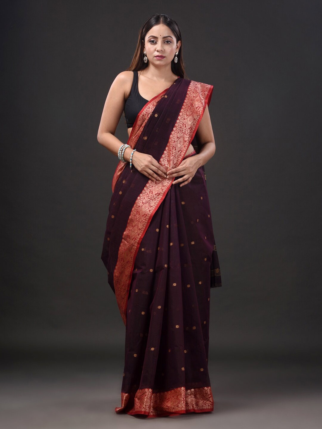 

Mitera Burgundy & Red Ethnic Motifs Woven Design Zari Pure Cotton Taant Saree