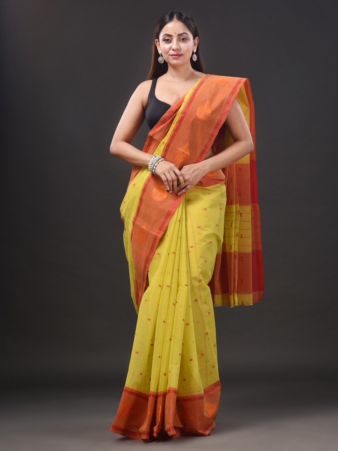 

Mitera Ethnic Motifs Woven Design Pure Cotton Taant Saree, Yellow