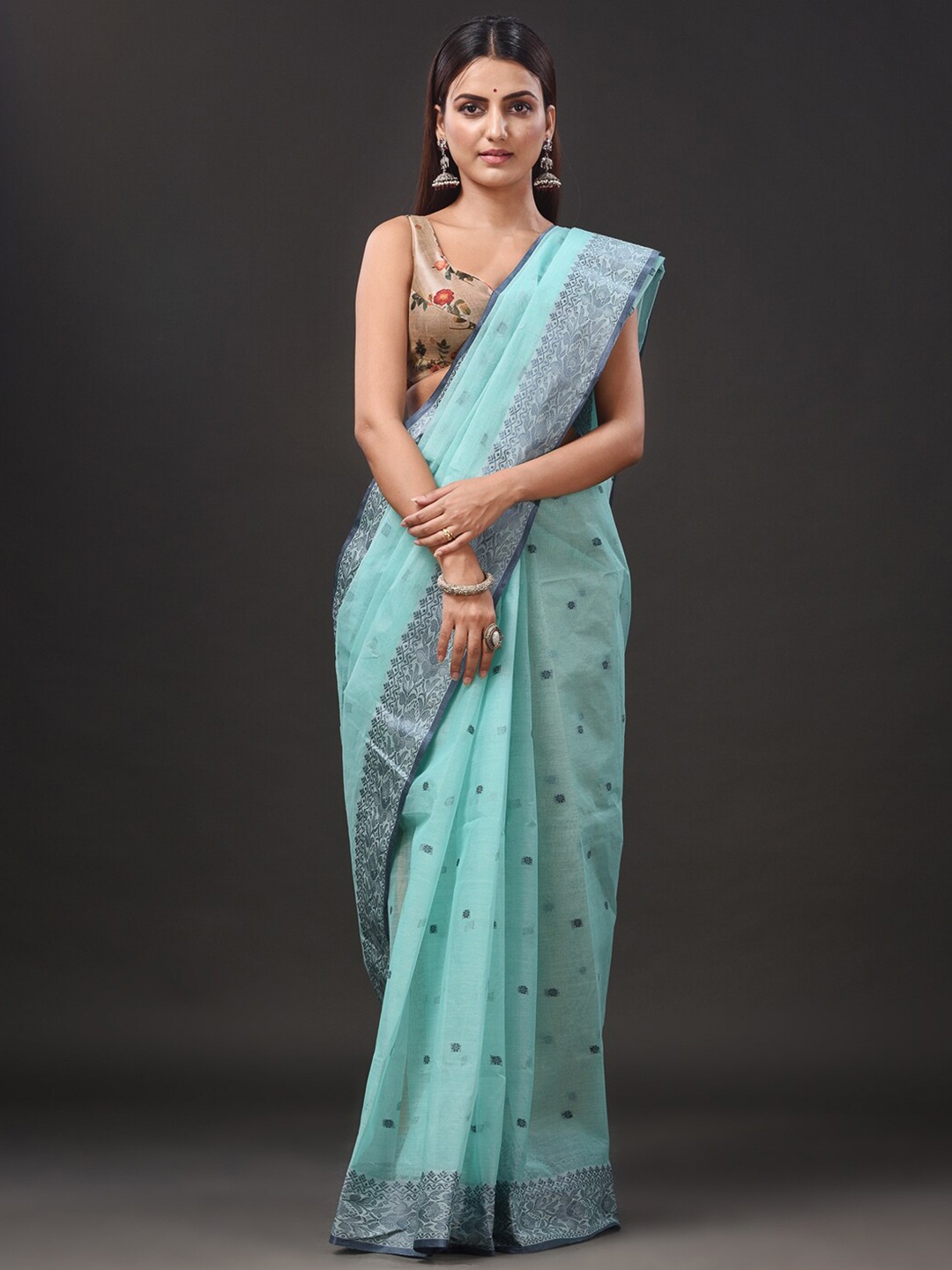 

Mitera Sea Green Ethnic Motifs Woven Design Pure Cotton Taant Saree