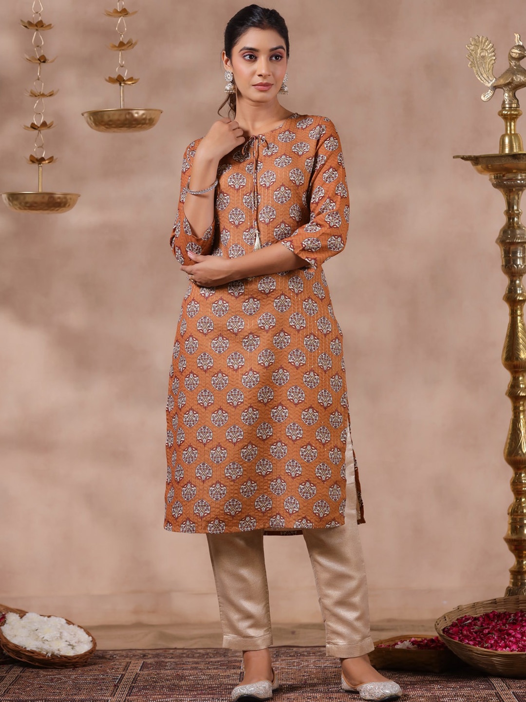 

Anubhutee Ethnic Motifs Printed Tie-Up Neck Straight Kurta, Mustard