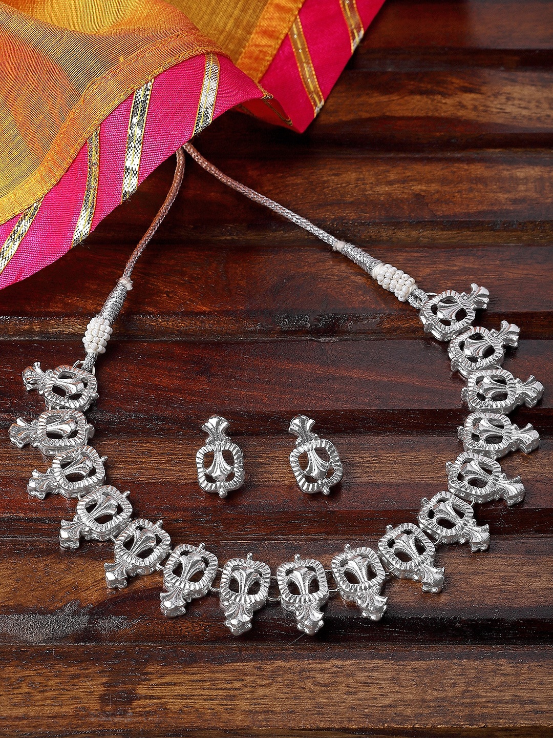 

KARATCART Silver-Plated Kundan Studded Necklace and Earrings