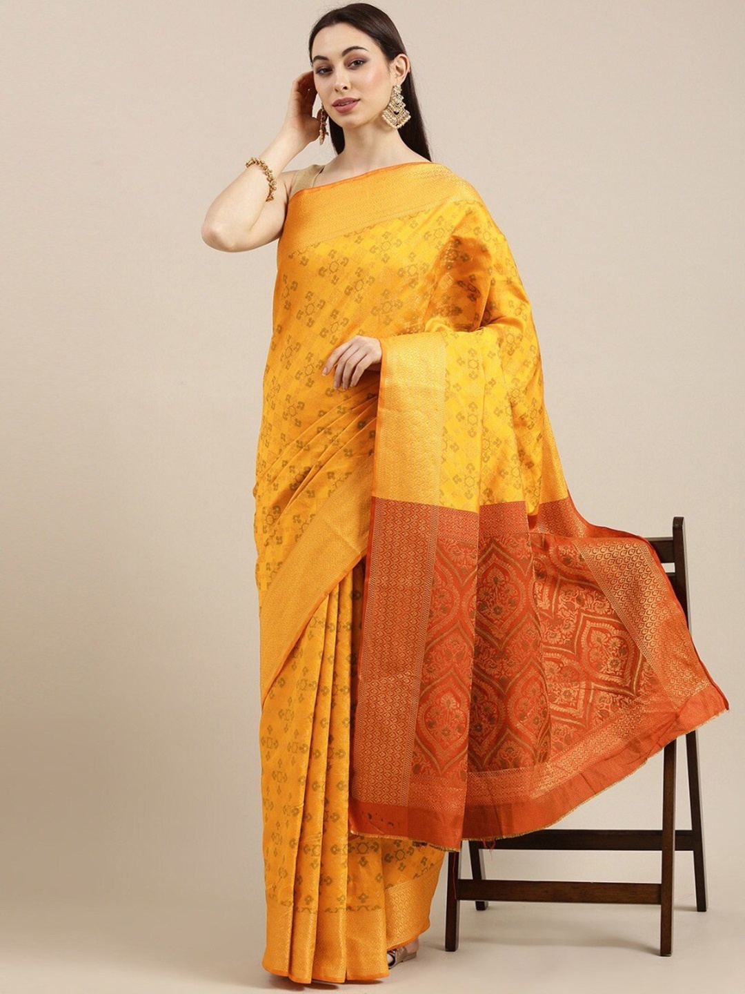 

Mitera Mustard & Orange Ethnic Motifs Woven Design Zari Silk Blend Kanjeevaram Saree
