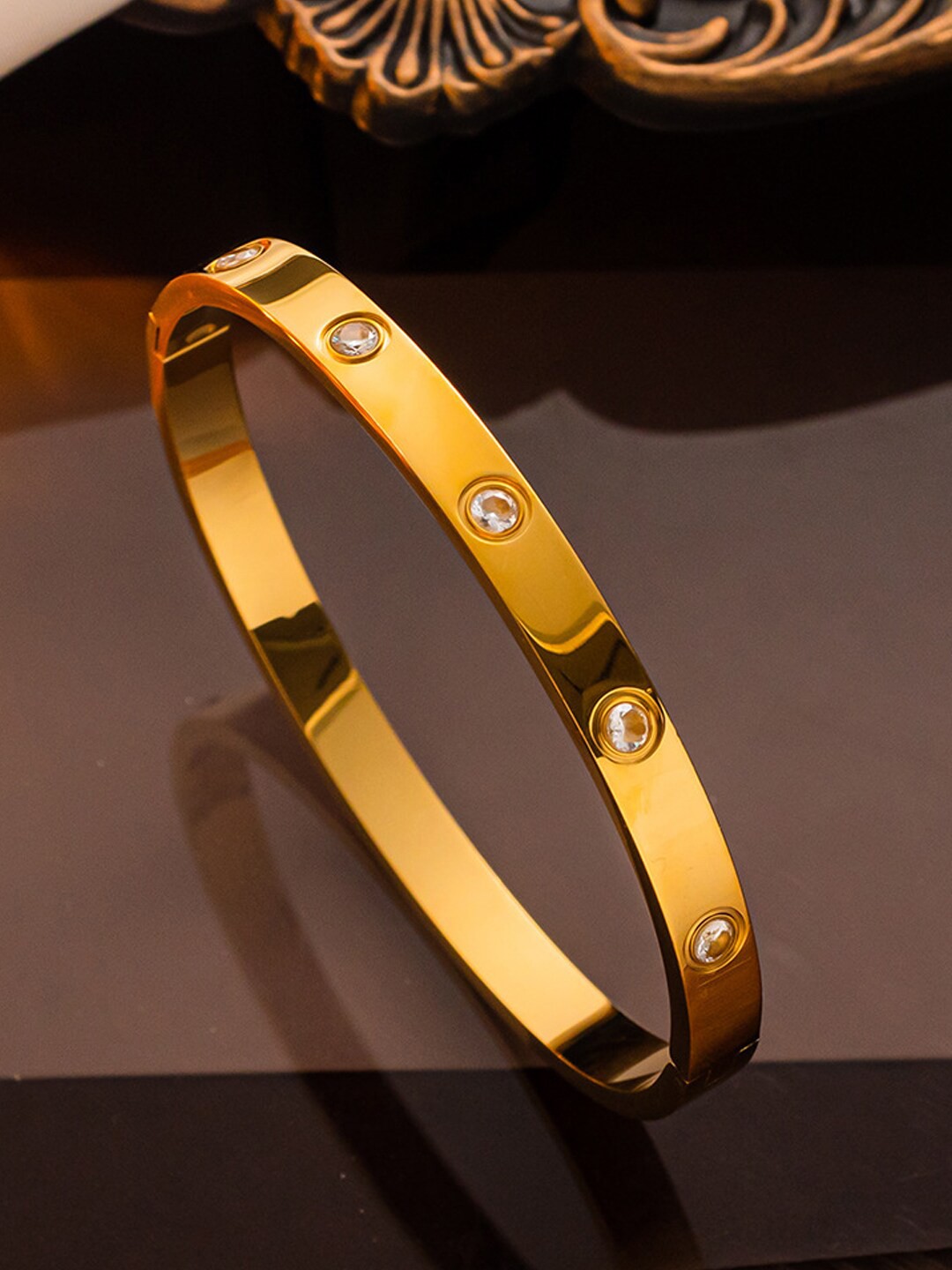 

Designs & You Gold Plated Stainless Steel American Diamond Studded Bangle Style Bracelet