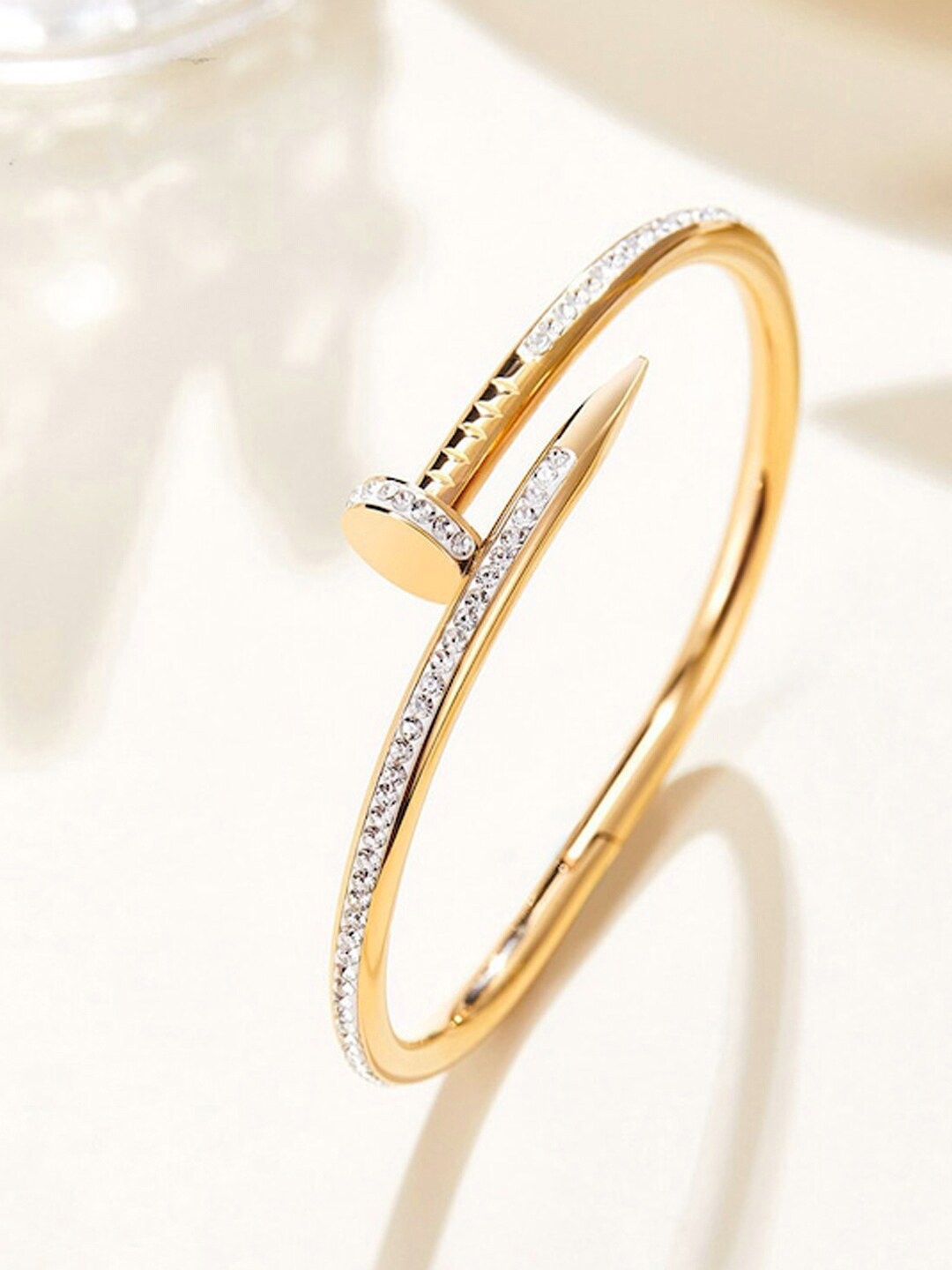 

Designs & You Gold Plated Stainless Steel American Diamond Studded Bangle-Style Bracelet