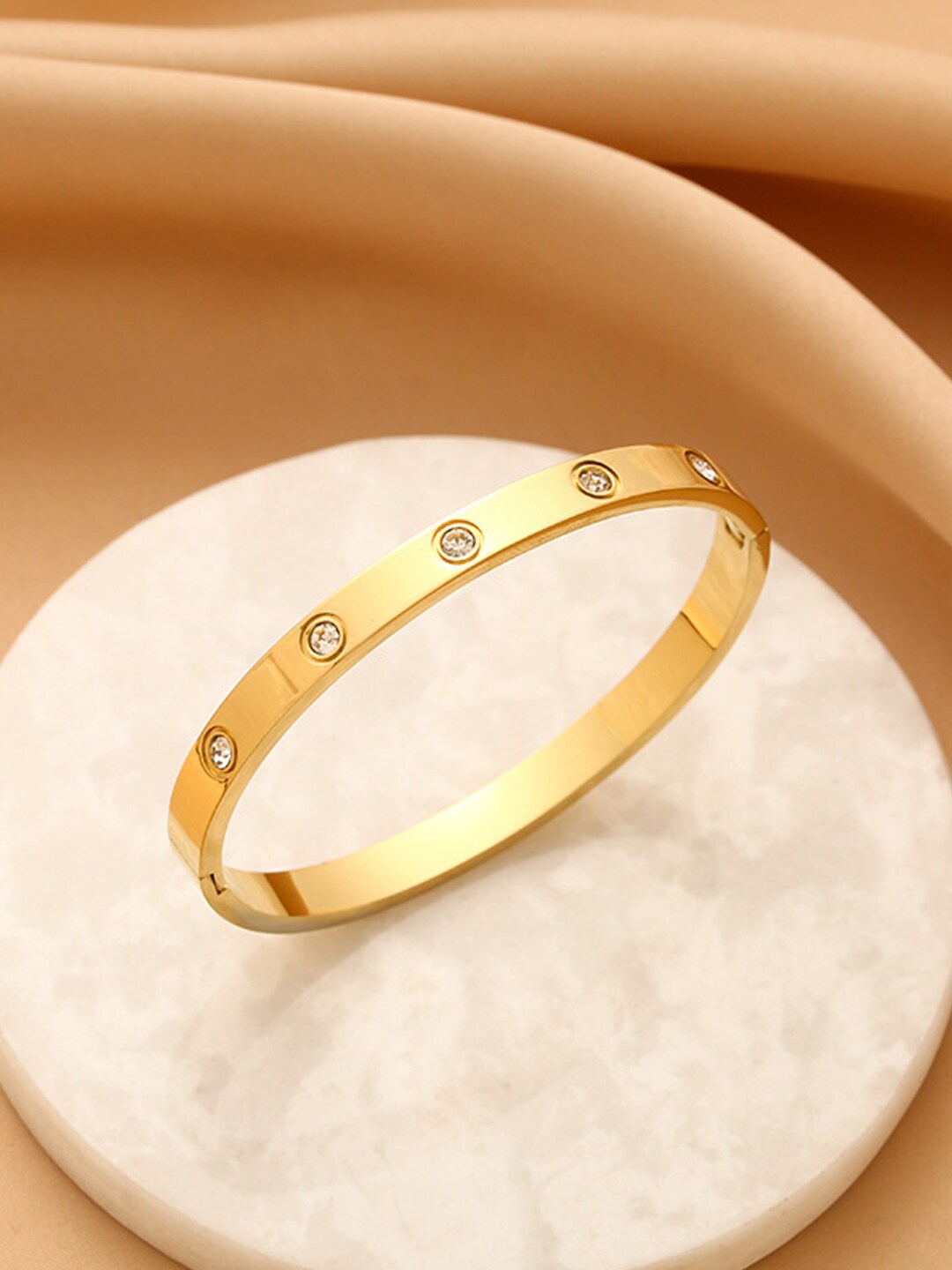 

Jewels Galaxy American Diamond Gold-Plated Bangle-Style Bracelet
