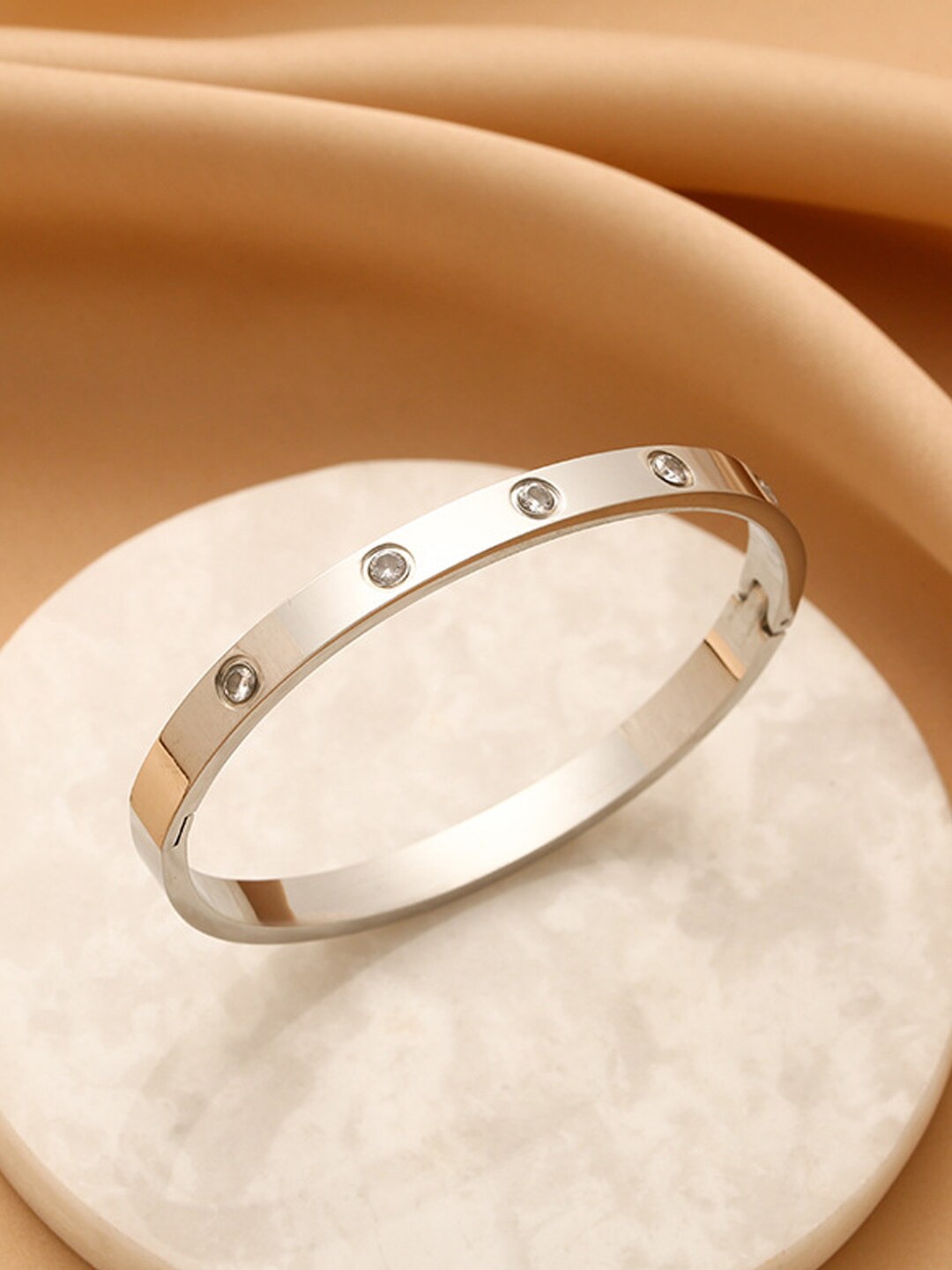 

Jewels Galaxy American Diamond Silver-Plated Bangle-Style Bracelet
