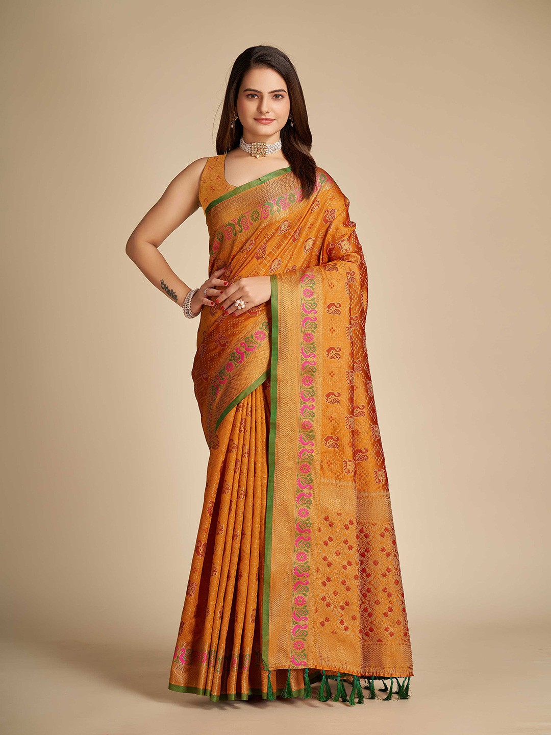

Mitera Orange Ethnic Motifs Woven Design Zari Silk Blend Patola Saree