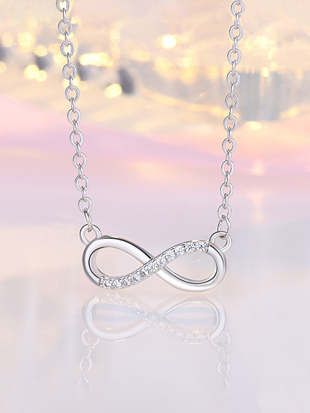 

Jewels Galaxy Silver Plated AD Studded Infinity Pendant With Chain