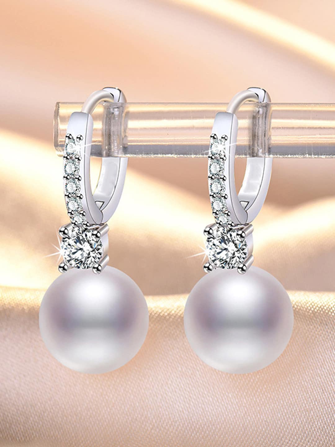 

Jewels Galaxy Silver-Plated American Diamond Studded Contemporary Drop Earrings