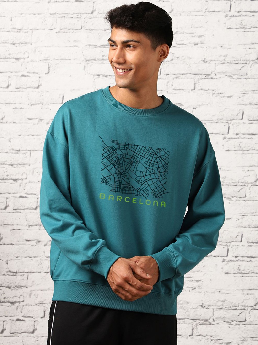 

NOBERO Barcelona Printed Round Neck Long Sleeves Oversized Pullover Sweatshirt, Blue