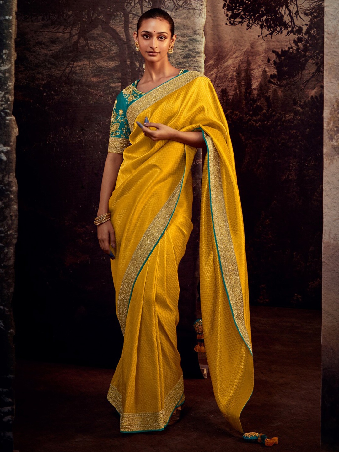 

Mitera Yellow & Blue Ethnic Motifs Woven Design Zari Saree