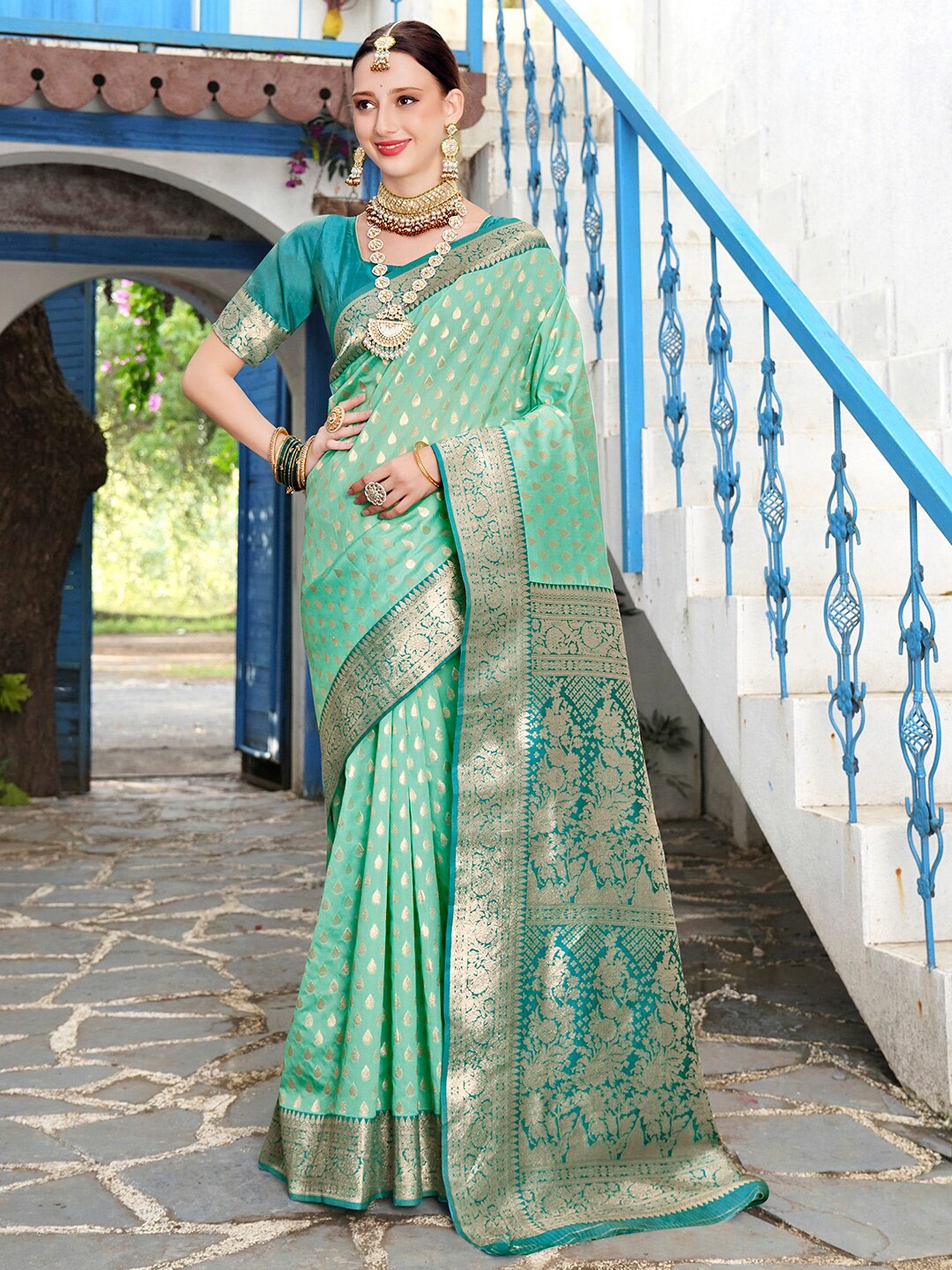 

Anouk Turquoise Blue & Gold-Toned Ethnic Motifs Woven Design Zari Kanjeevaram Saree