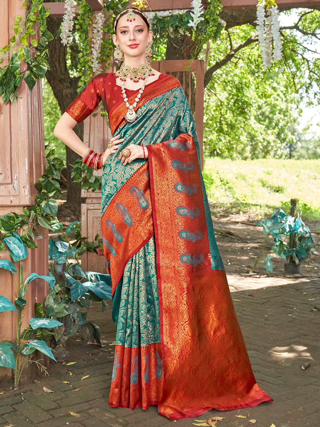 

Anouk Turquoise Blue & Red Paisley Woven Design Zari Art Silk Kanjeevaram Saree