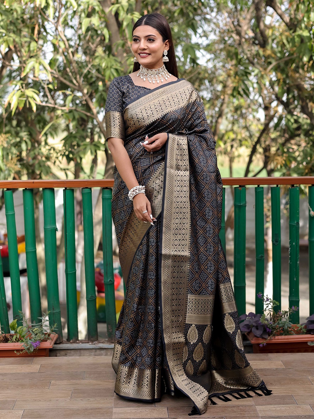 

Mitera Black & Gold-Toned Bandhani Printed Zari Patola Saree