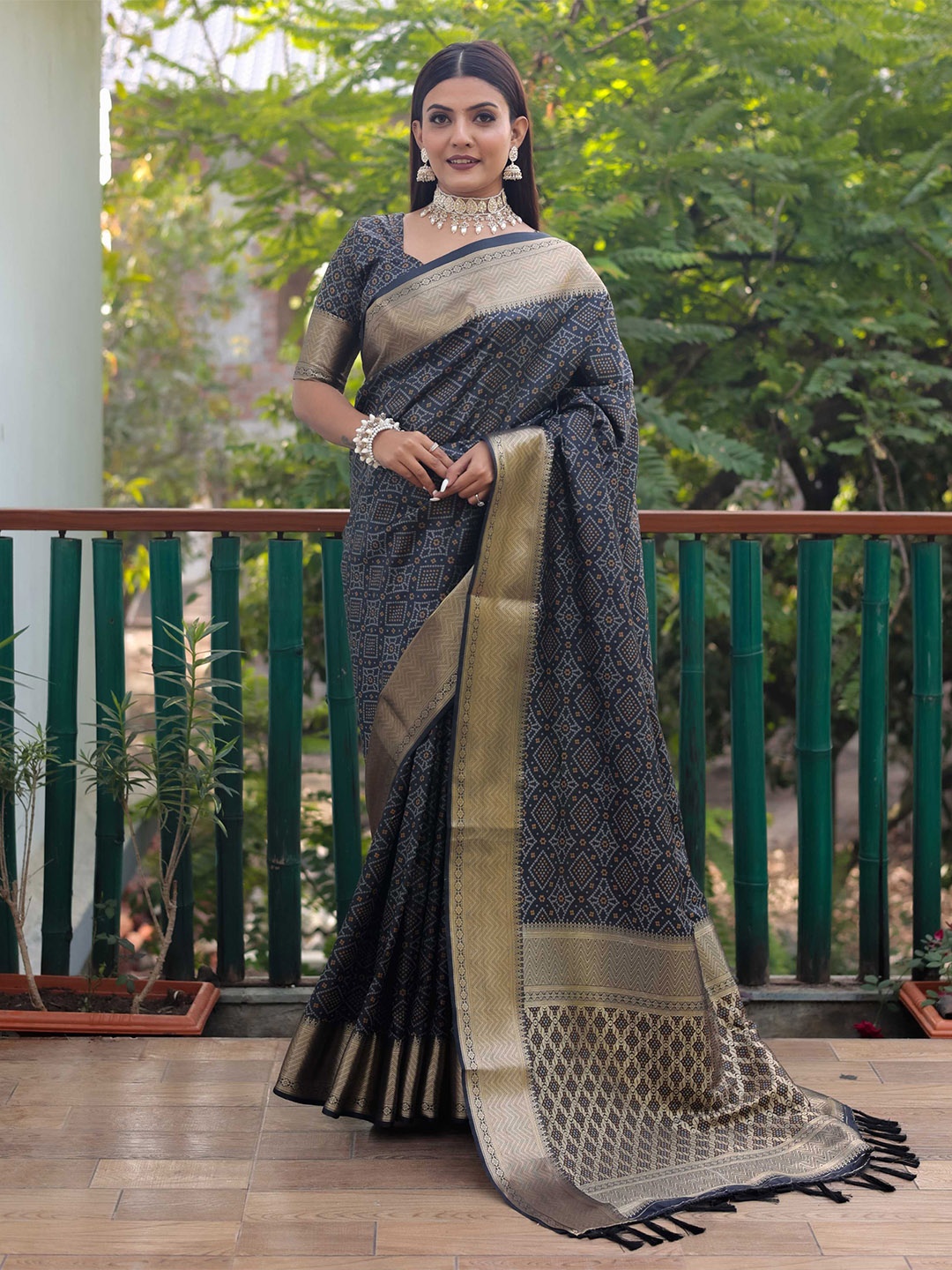 

Mitera Black & Gold-Toned Bandhani Printed Zari Patola Saree