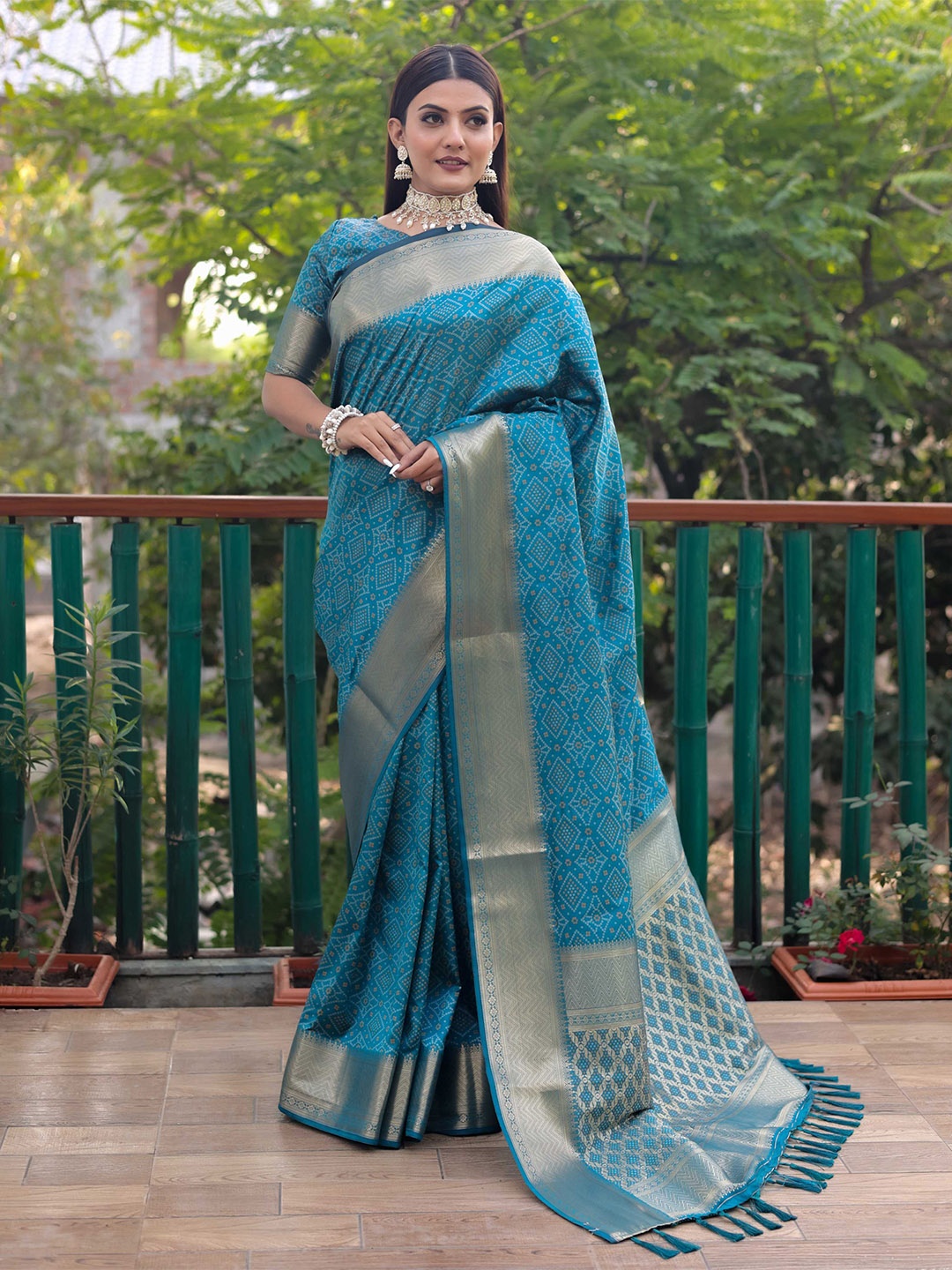 

Mitera Blue & White Bandhani Printed Zari Patola Saree