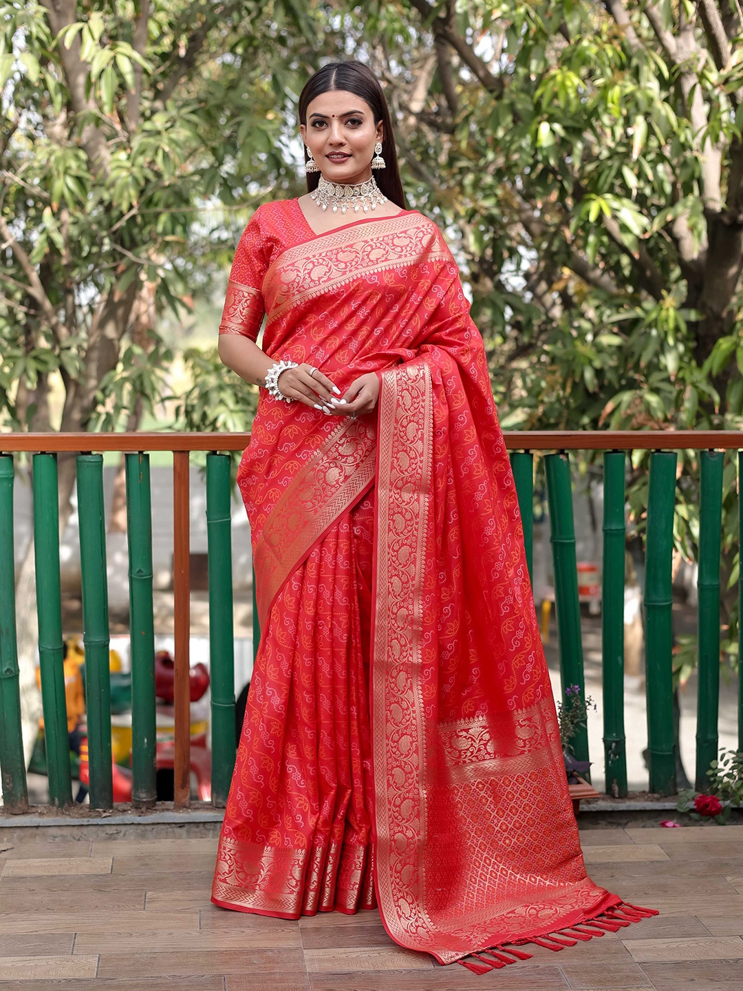 

Mitera Red & White Bandhani Printed Zari Patola Saree
