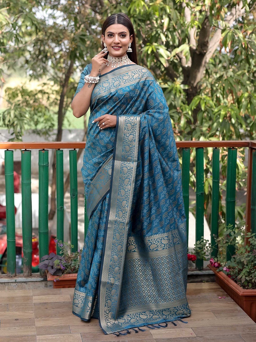 

Mitera Blue & Gold-Toned Bandhani Printed Zari Patola Saree