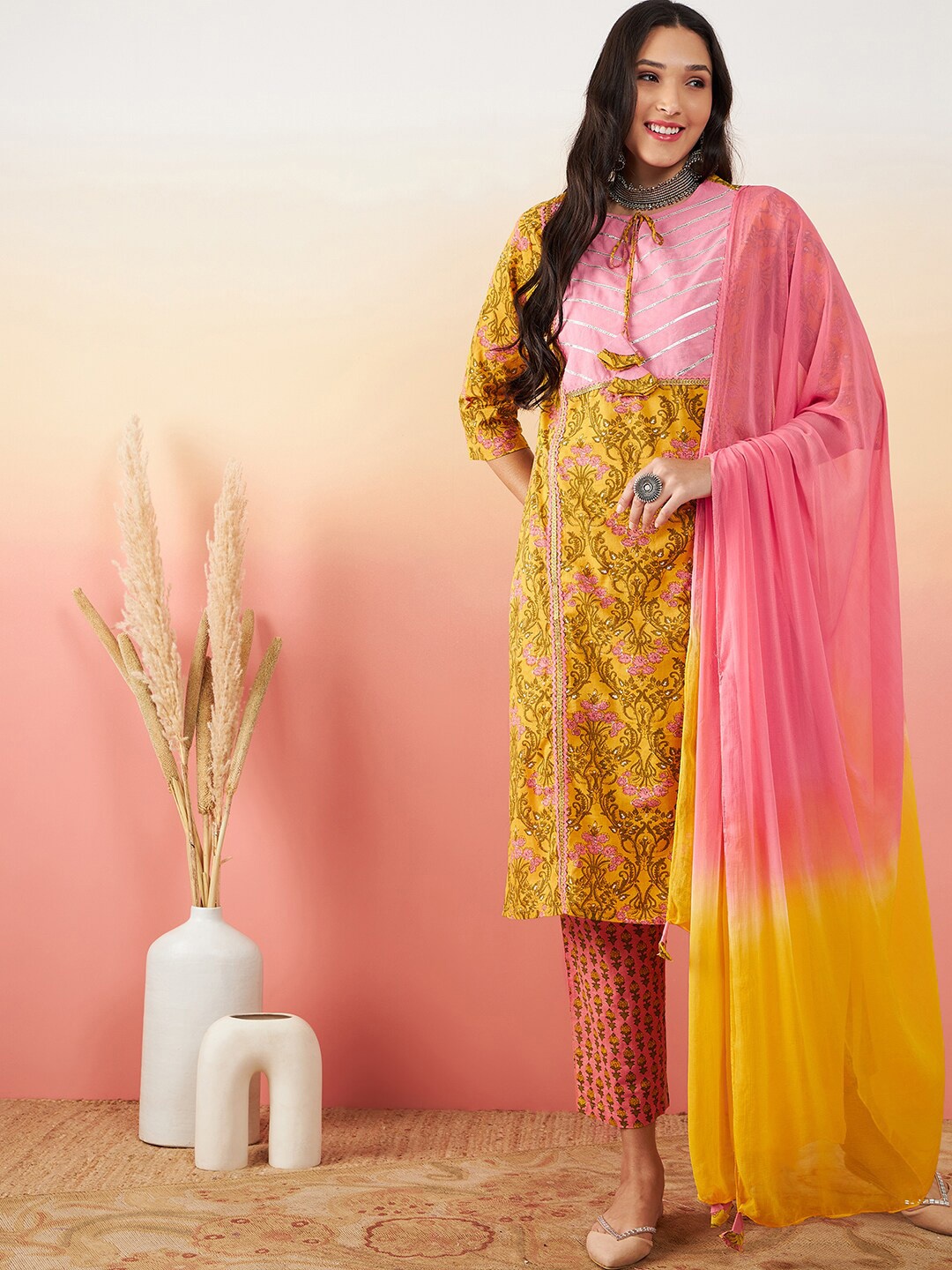 

Vastramyaa Floral Printed Regular Gotta Patti Pure Cotton Kurta with Trousers & Dupatta, Mustard