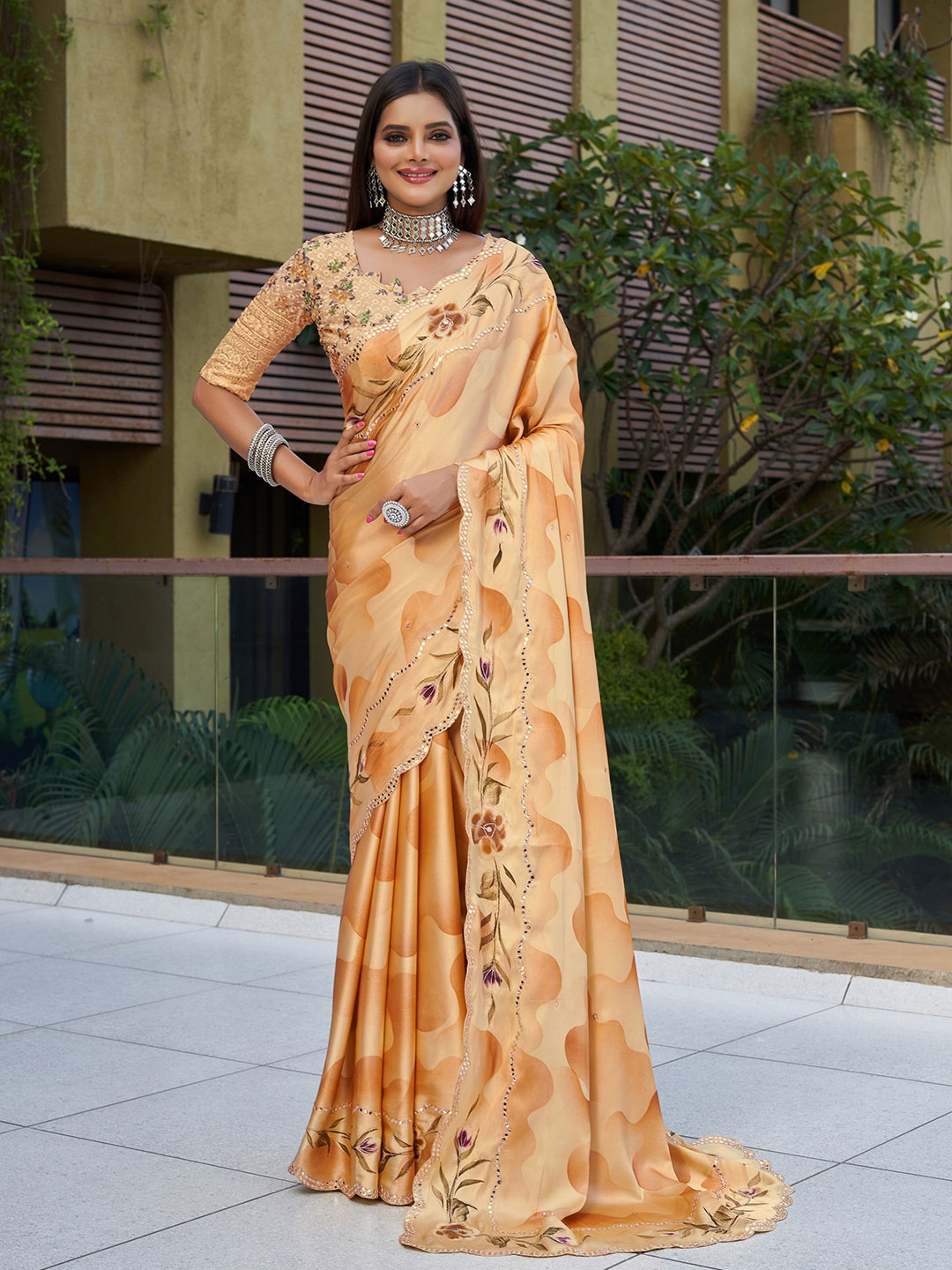 

Mitera Orange & Green Floral Printed Mirror Work Pure Georgette Saree