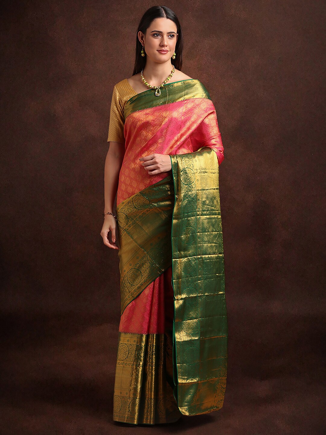 

Kalyan Silks Orange & Green Woven Design Zari Pure Silk Kanjeevaram Saree