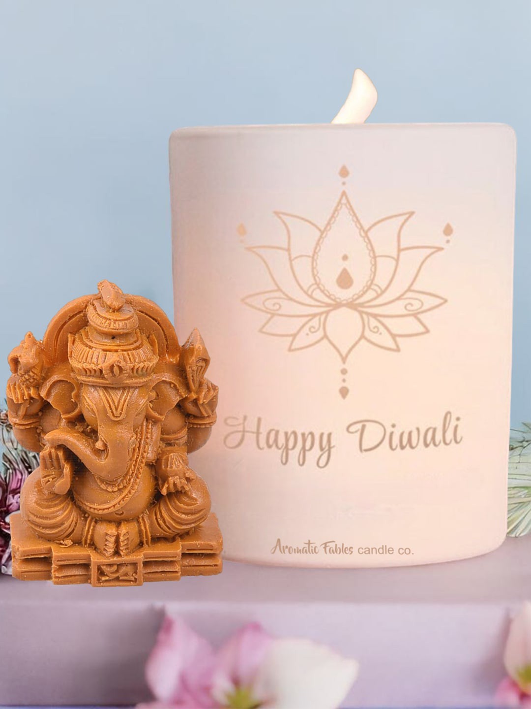 

Aromatic Fables White & Brown Sea Breeze Scented Glass Jar Candle With Ganesha Idol -400 g