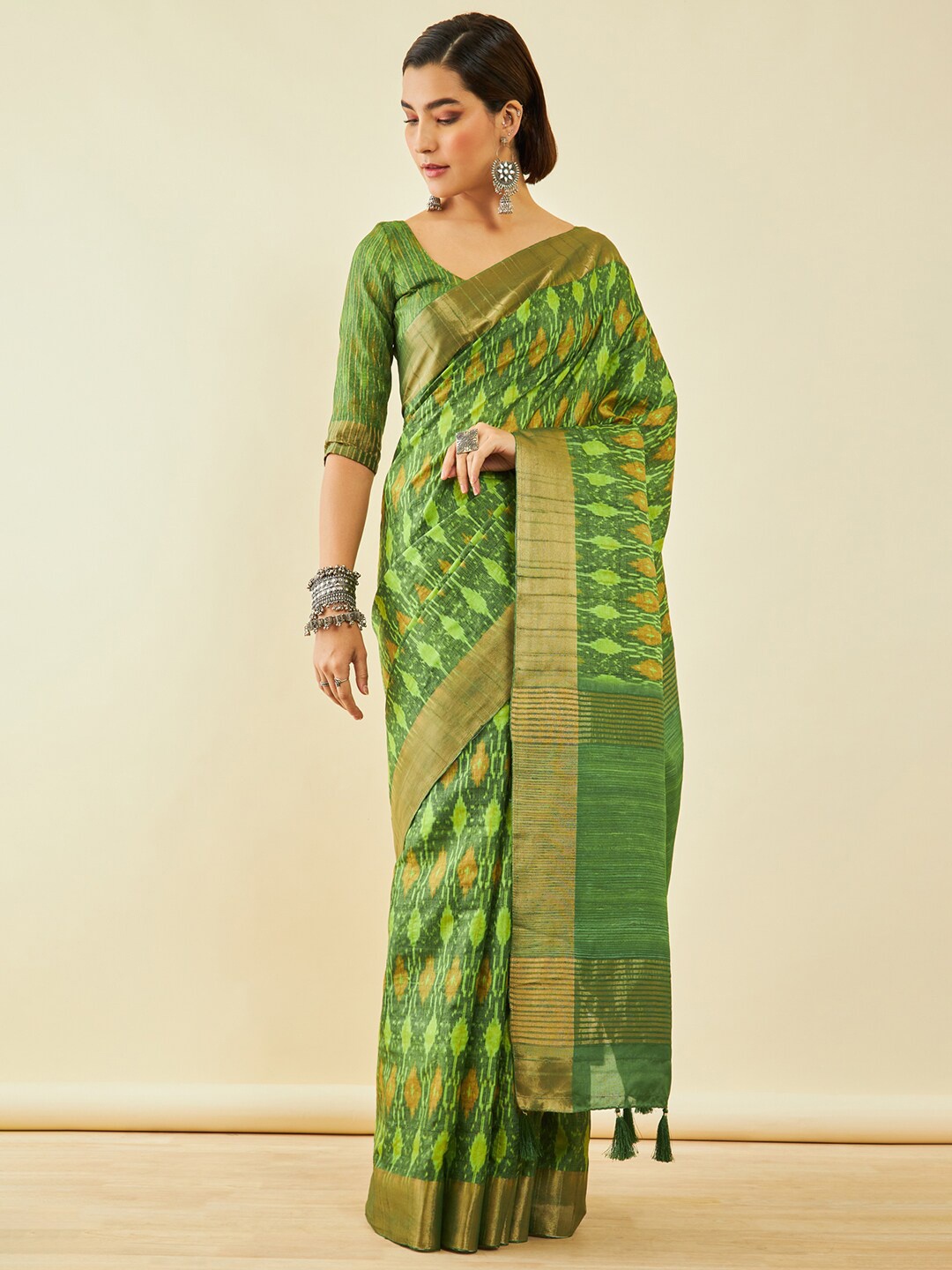 

Soch Green & Gold-Toned Geometric Printed Zari Ikat Saree