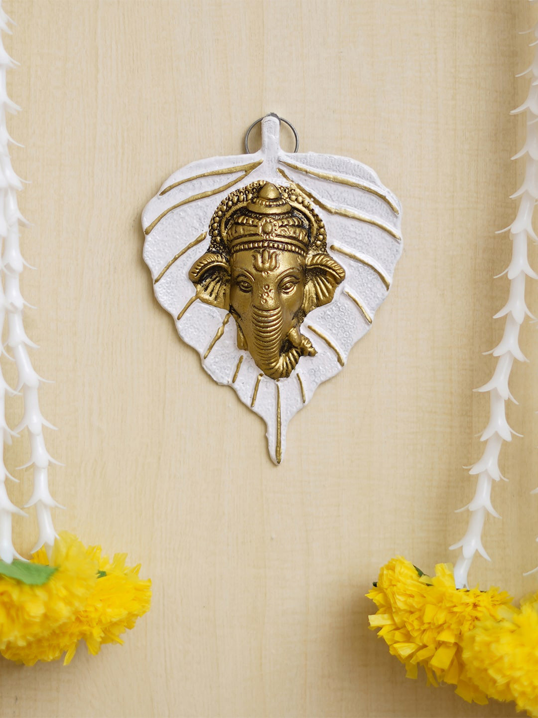 

eCraftIndia White Lord Ganesha Face On Leaf Wall Hanging