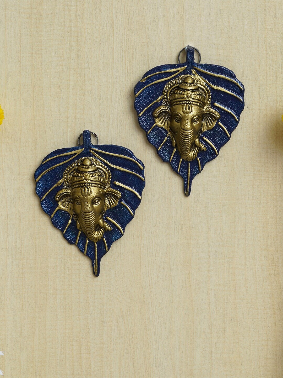 

eCraftIndia Blue & Gold Toned 2 Pieces Lord Ganesha Face On Peepal Leaf Wall Hangings