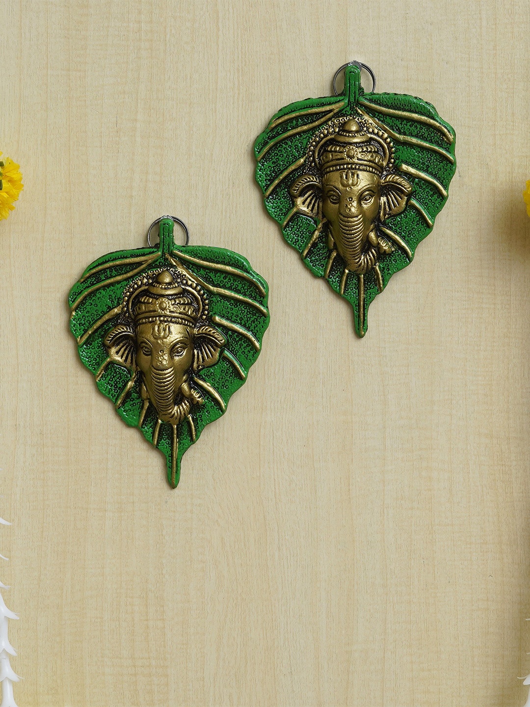

eCraftIndia Green & Golden 2 Pieces Lord Ganesha Face On Peepal Leaf Wall Hangings