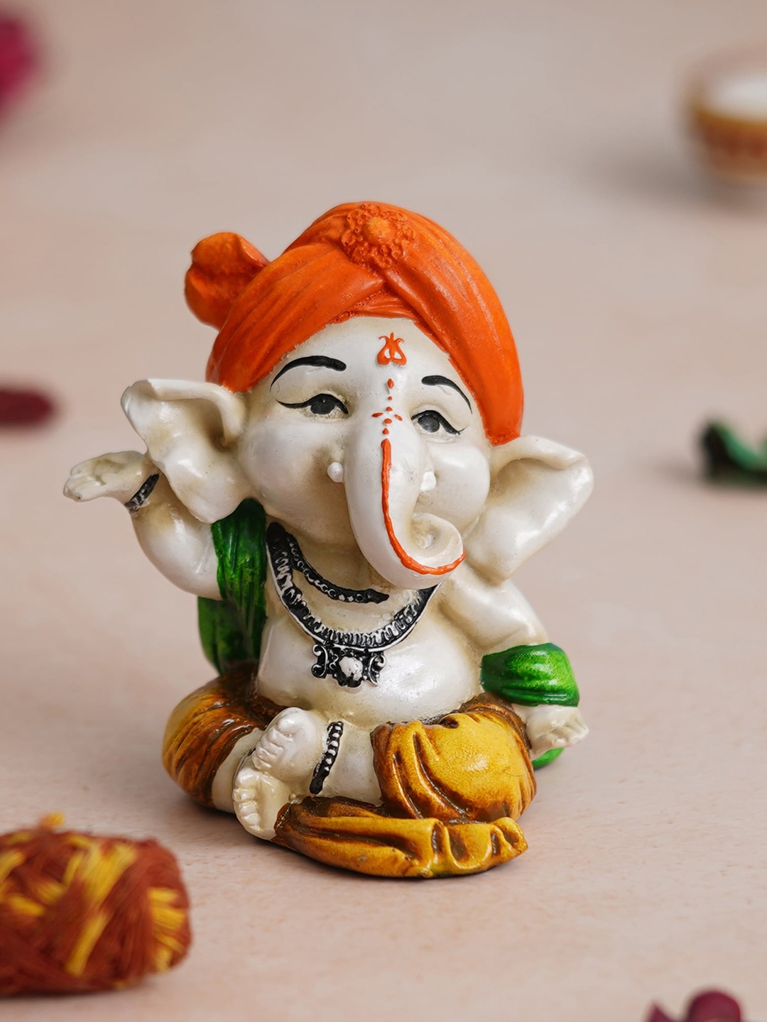 

eCraftIndia Orange Handcrafted Dancing Lord Ganesha Idol While Sitting Polyresin Showpiece